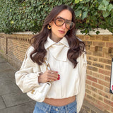 Model wearing gold layered hoop stud earrings — demi-fine gold plated jewellery UK