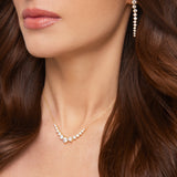 Gold skeleton stud earrings with white cubic zirconia stones by Rosie Fortescue Jewellery