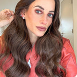 Model wearing large silver CZ diamond studs — statement stud earrings UK