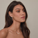 Gold skeleton stud earrings with white cubic zirconia stones by Rosie Fortescue Jewellery