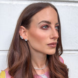 Model wearing small silver CZ diamond studs — everyday demi-fine stud earrings