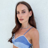 Model wearing large silver CZ diamond studs — statement stud earrings UK