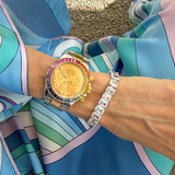 Model wearing silver CZ emerald cut tennis bracelet — demi-fine diamond bracelet UK
