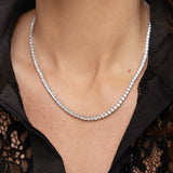 Model wearing silver CZ tennis necklace — demi-fine white stone tennis necklace UK